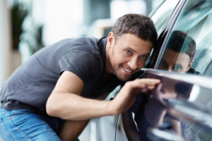 man looking at car from side.jpg