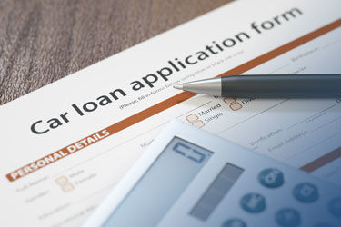 pen and calculator on car loan application form.jpg